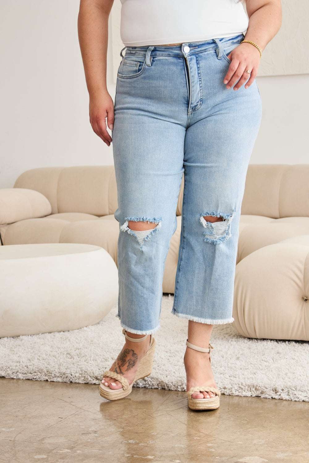 RFM Full Size Tummy Control High Waist Raw Hem Distressed Jeans with pocketed design and moderate stretch.