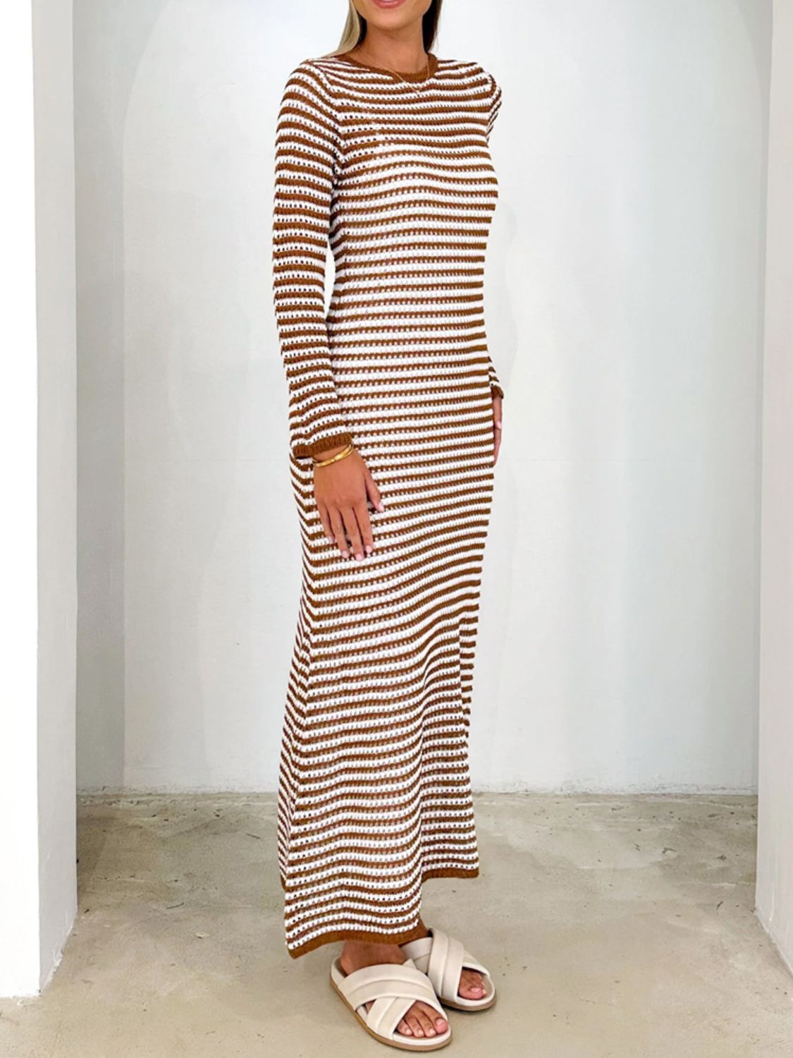 Devine tied round neck striped sweater dress in brown and white with moderate stretch.