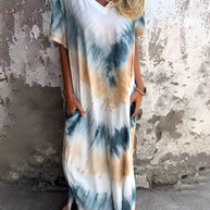 Full size pocketed tie-dye short sleeve dress with blue and beige pattern.