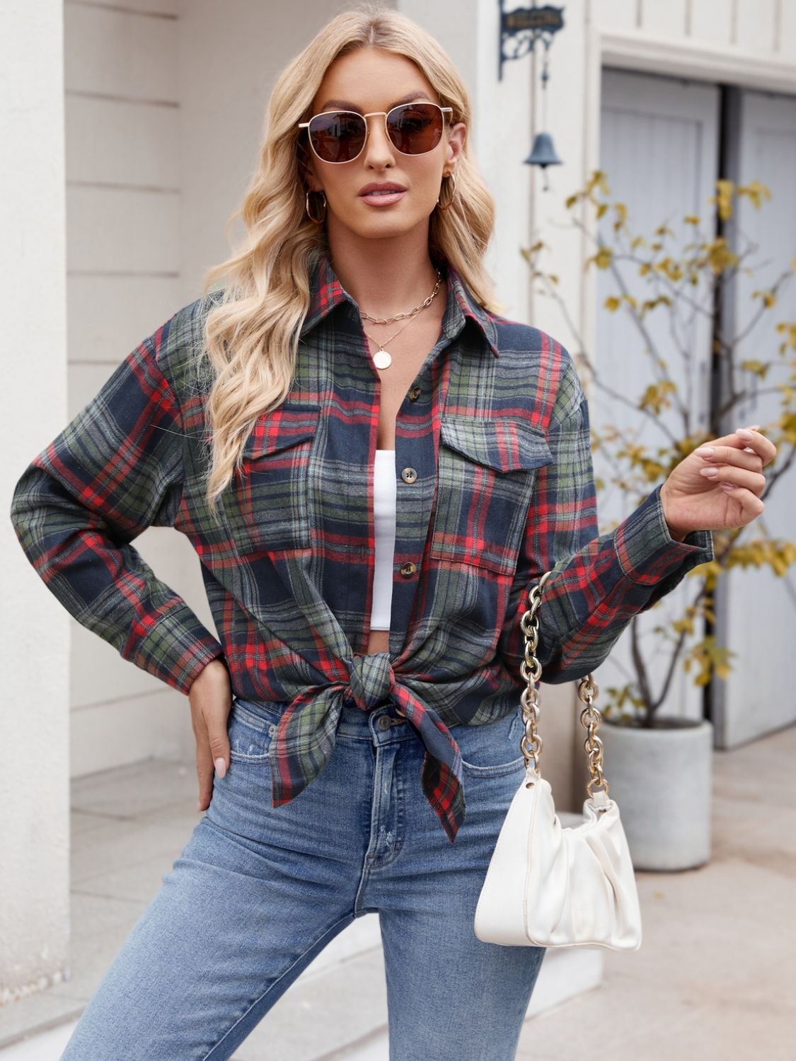 Woman wearing Mandy Plaid Button Up Long Sleeve Shirt, buttoned with chest pockets, in a casual outdoor setting.