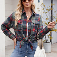 Woman wearing Mandy Plaid Button Up Long Sleeve Shirt, buttoned with chest pockets, in a casual outdoor setting.