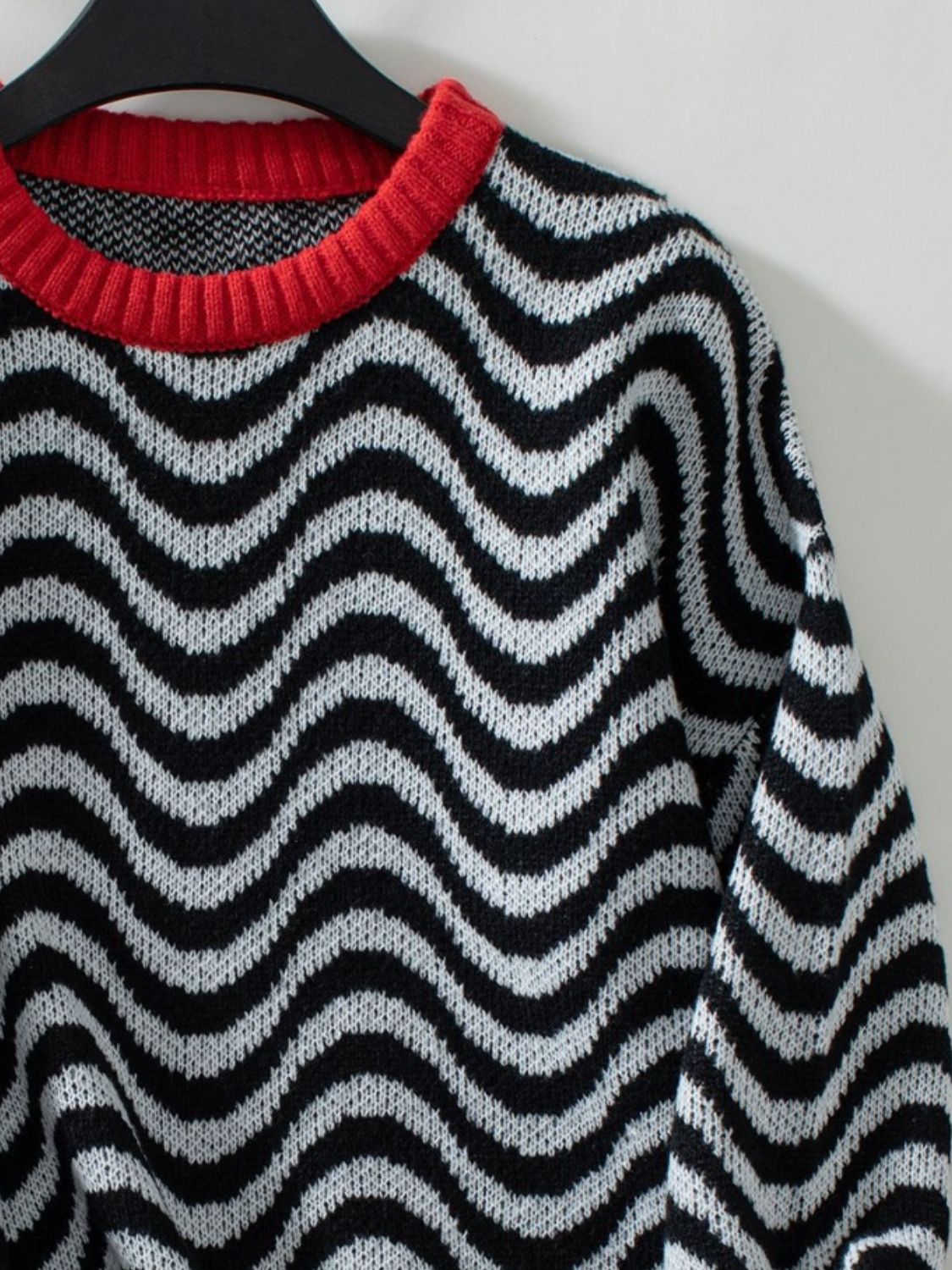 Wavy Stripes Round Neck Long Sleeve Sweater with black and white pattern and red collar.