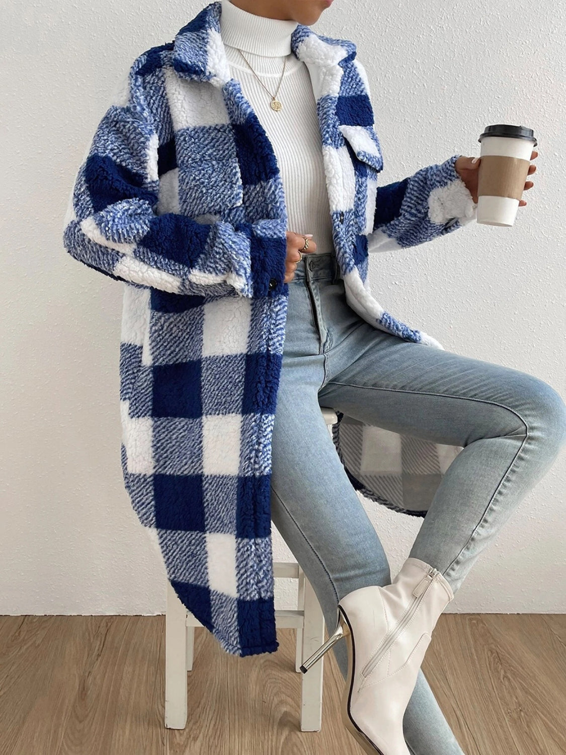 Plaid collared neck button down coat in blue and white.