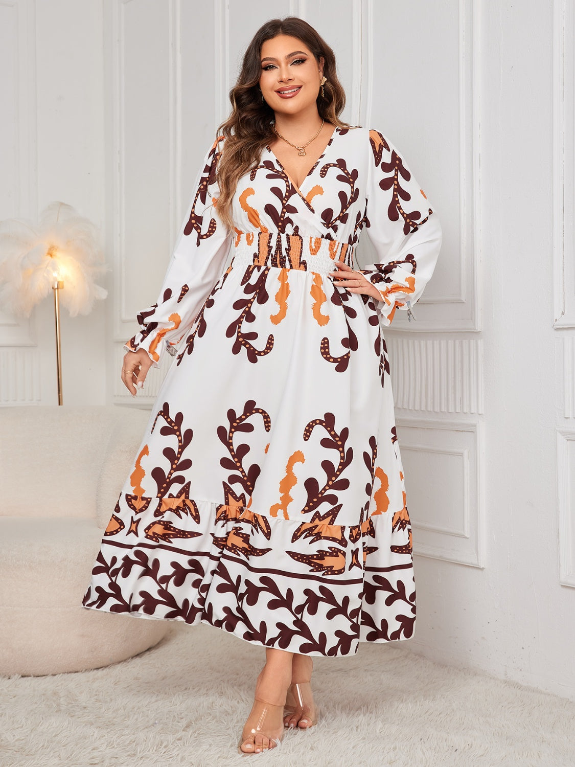 Plus size printed surplice dress with flounce sleeves, ruffled design, 100% polyester.