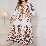 Plus size printed surplice dress with flounce sleeves, ruffled design, 100% polyester.