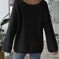 Black bow boat neck long sleeve sweater, slightly stretchy polyester, casual fit.