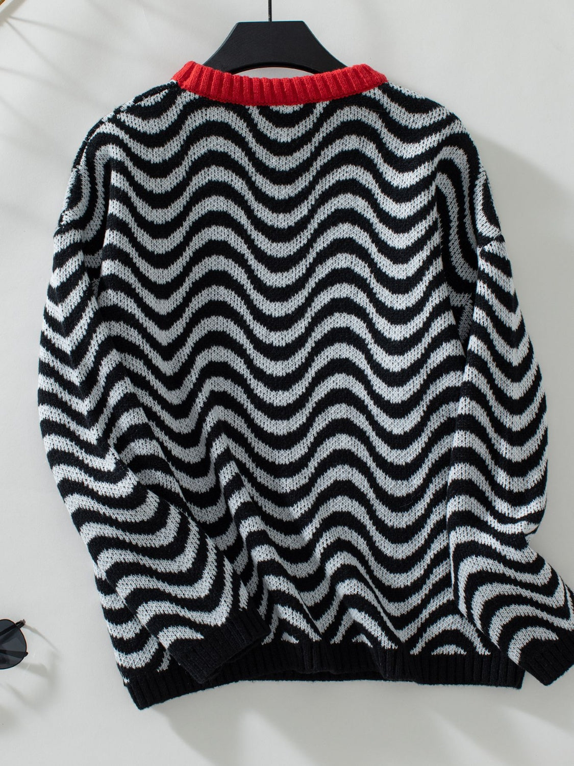 Wavy Stripes Round Neck Long Sleeve Sweater with black and white pattern and red collar.