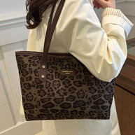 Leopard polyester tote bag, large size, imported, featuring leopard print design.