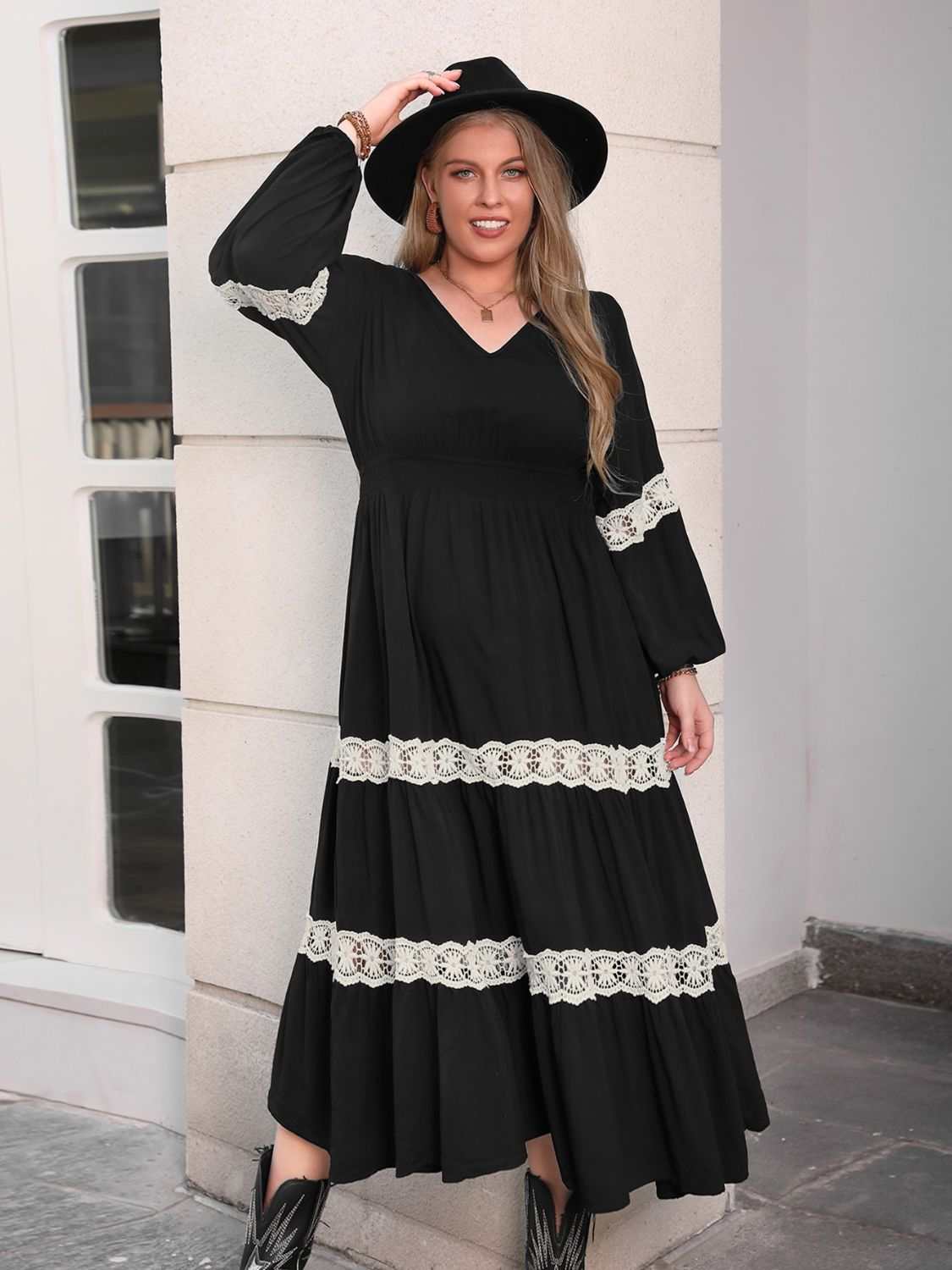 Plus size V-neck long sleeve midi dress with lace detail.