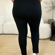 Black wide waistband sports leggings, stretchy and opaque.