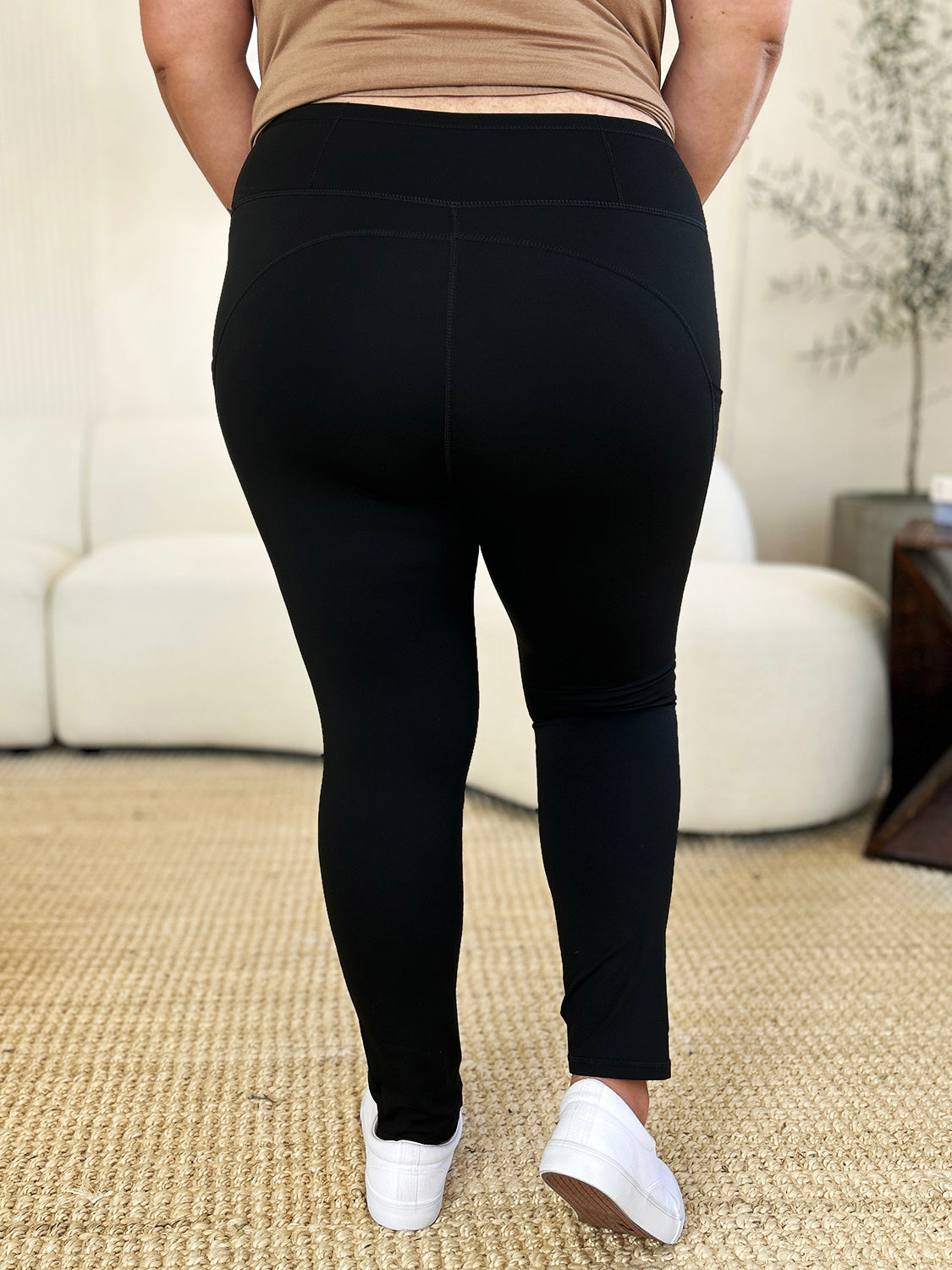 Black wide waistband sports leggings, stretchy and opaque.