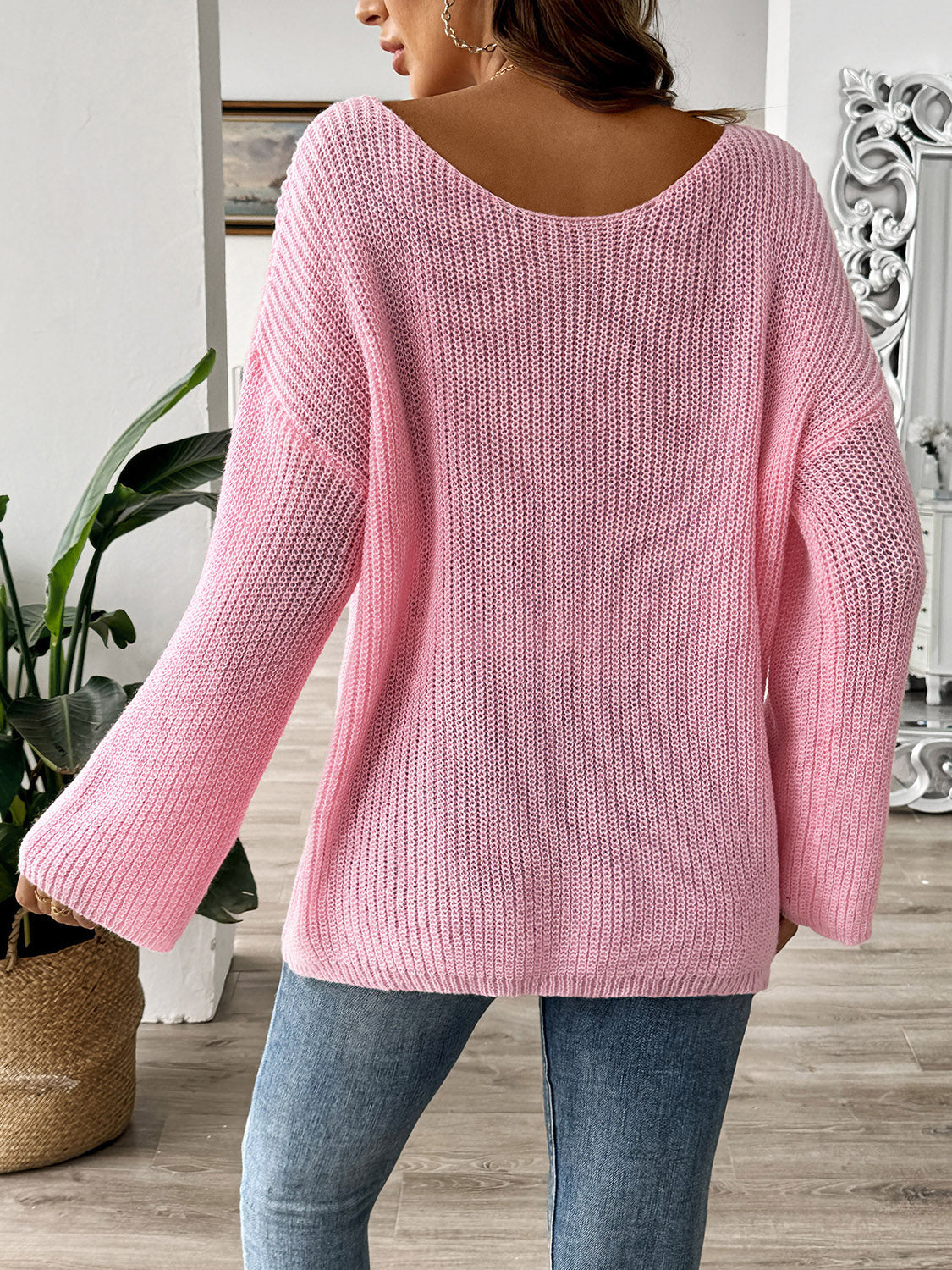 Pink bow boat neck long sleeve sweater made of polyester, slightly stretchy, styled with casual fit.