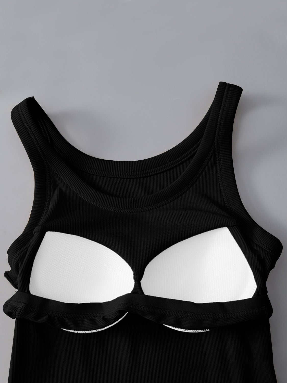 Black round neck tank with built-in bra, made of viscose and spandex, moderate stretch.