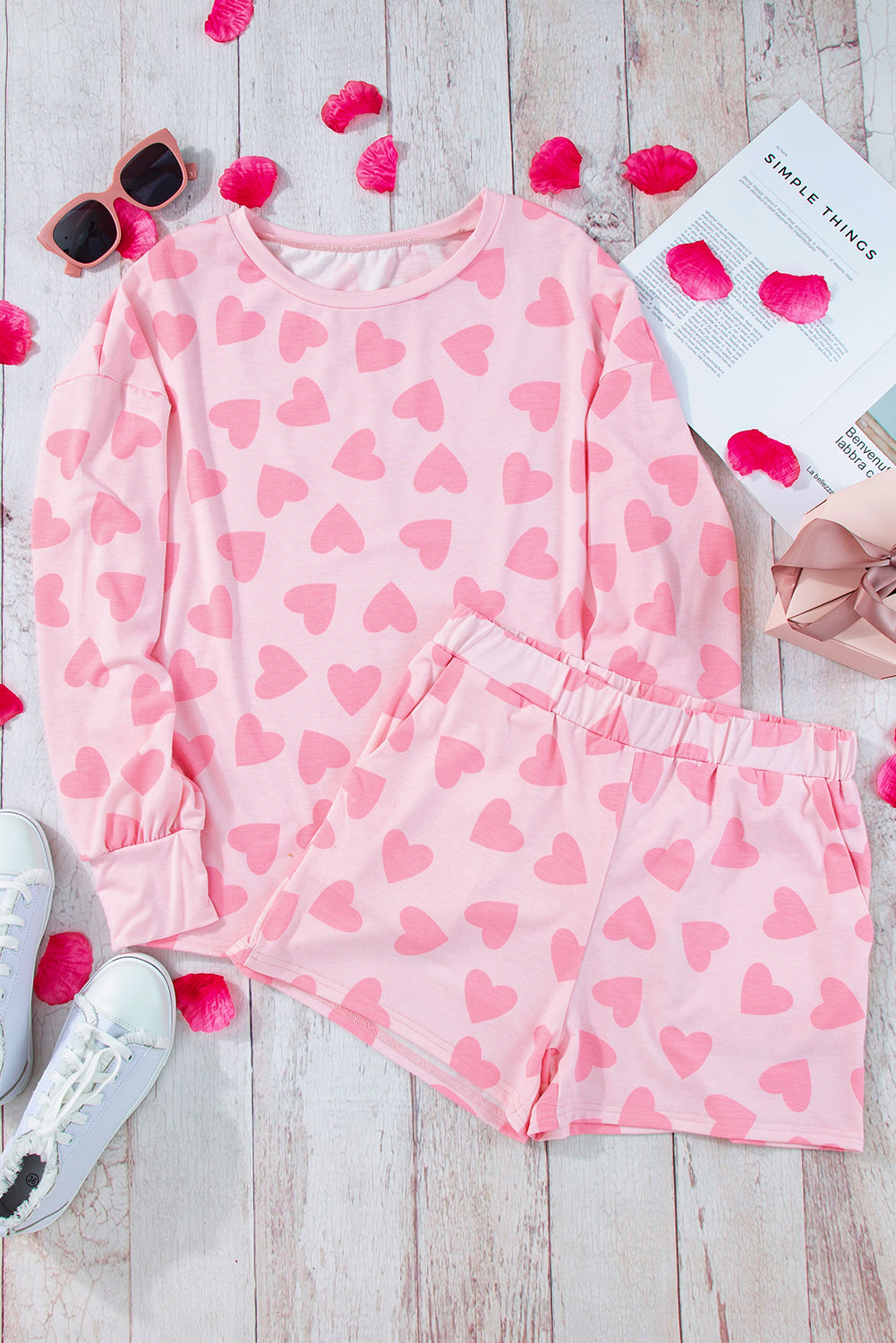 Heart print long sleeve top and shorts lounge set in pink on display with accessories.