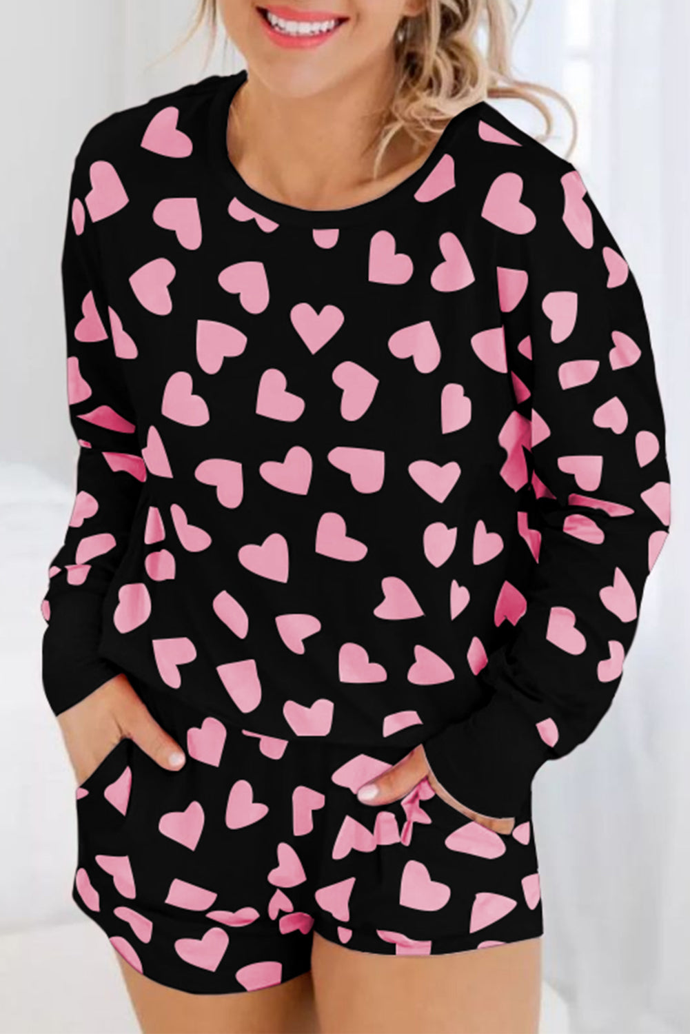 Heart print long sleeve top and shorts lounge set in black and pink.