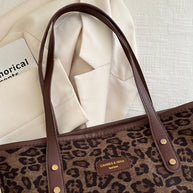 Leopard polyester tote bag with brown handles and pattern, large size.