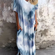 Full size pocketed tie-dye short sleeve dress with blue and white pattern.