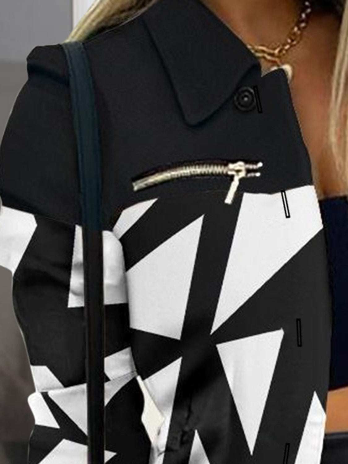 Printed button-up shacket with zip detail, black and white geometric pattern.