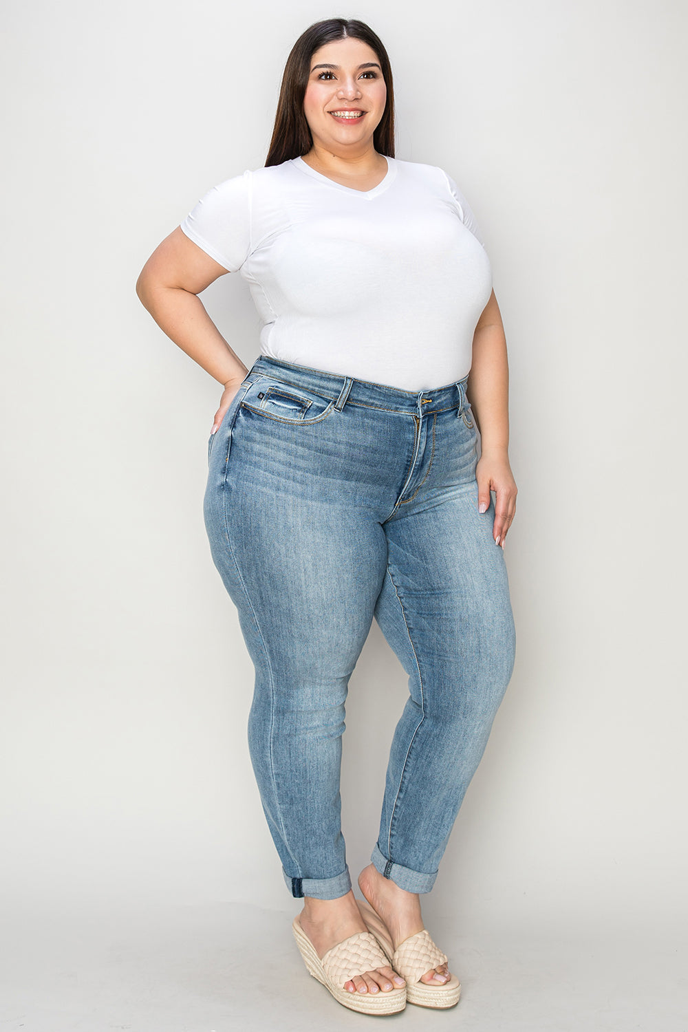 Judy Blue Full Size Cuffed Hem Slim Jeans on model, plus size fit, front view.