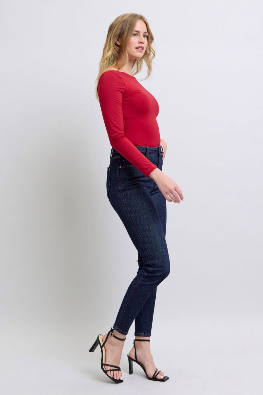 Judy Blue high-rise skinny jeans with heart-shaped back pockets, featuring a flattering and playful design, moderate stretch, and a versatile fit for various occasions.