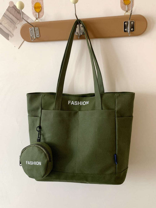 Canvas tote bag with pouch in green, durable and spacious design, perfect everyday accessory.