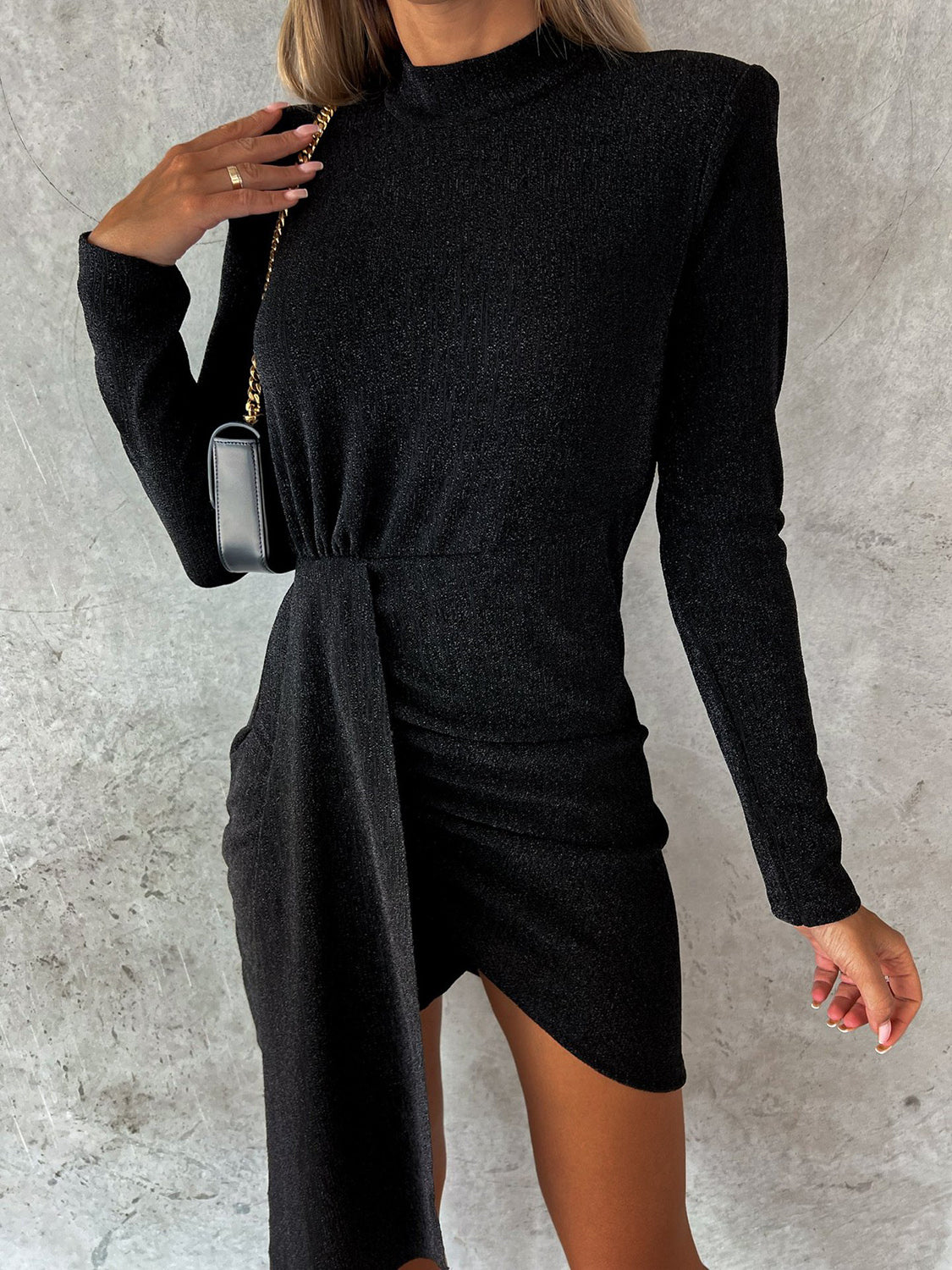 Heathered mock neck long sleeve mini dress in black, featuring basic style and slightly stretchy fabric.