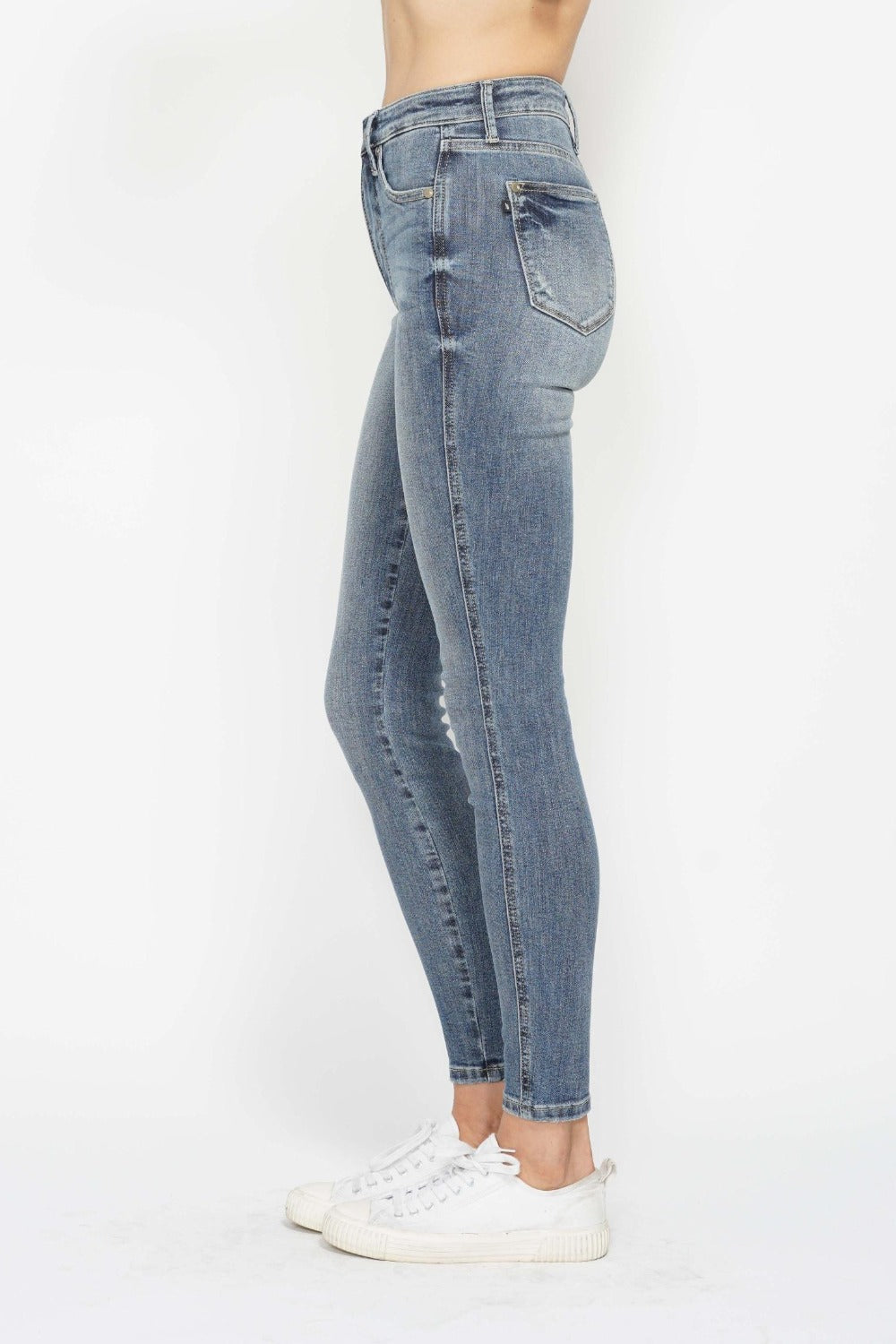 Judy Blue full size tummy control contrast wash skinny jeans with high rise fit shown on model.