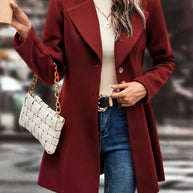 Women's stylish collared neck button up long sleeve coat in burgundy.