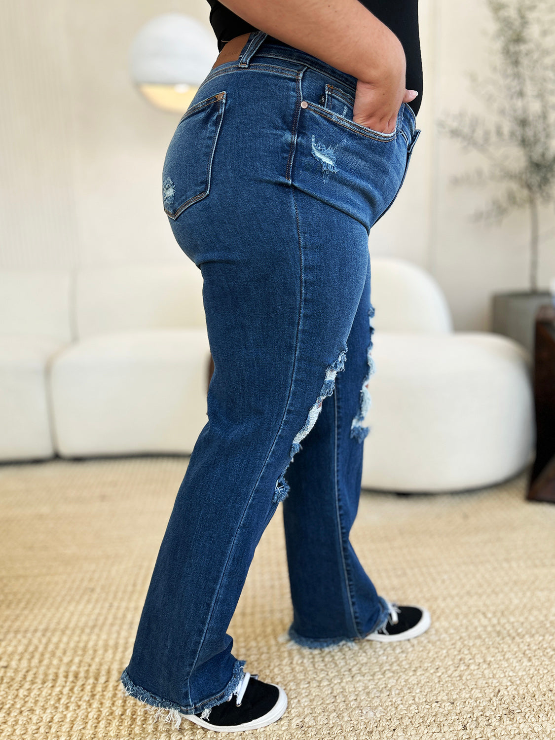 Judy Blue mid rise distressed raw hem jeans with moderate stretch.