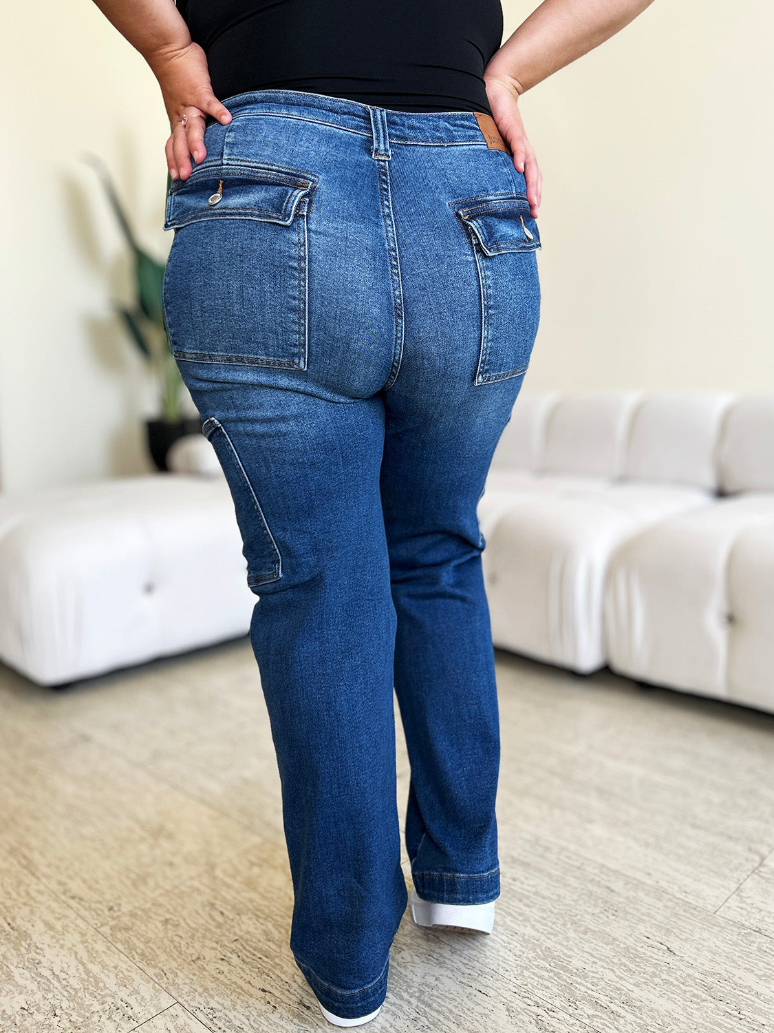 Judy Blue high-waist cargo jeans with side pockets, back view, slightly stretchy denim.