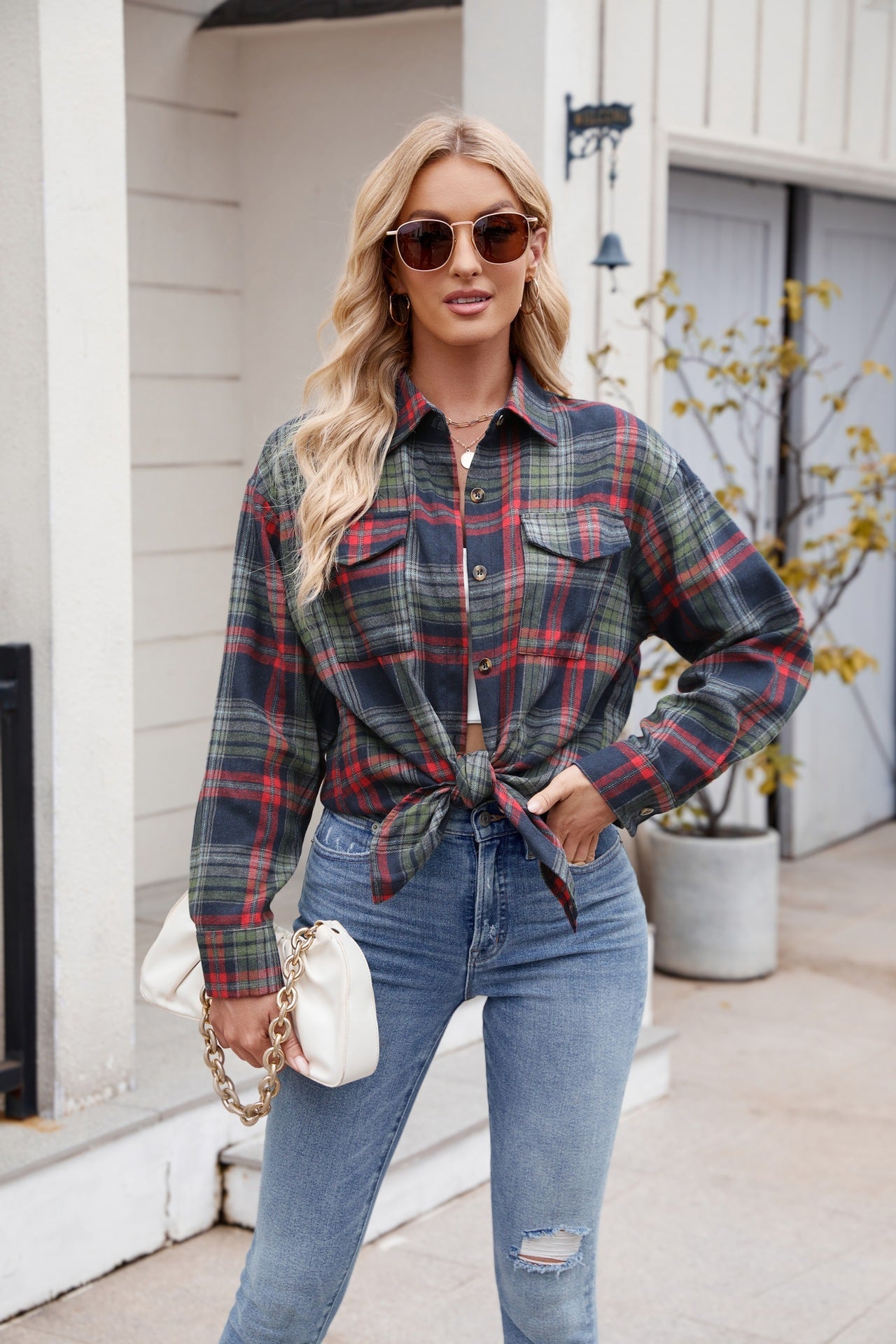 Mandy Plaid Button Up Long Sleeve Shirt with pockets and buttoned front, styled with jeans, outdoor background.