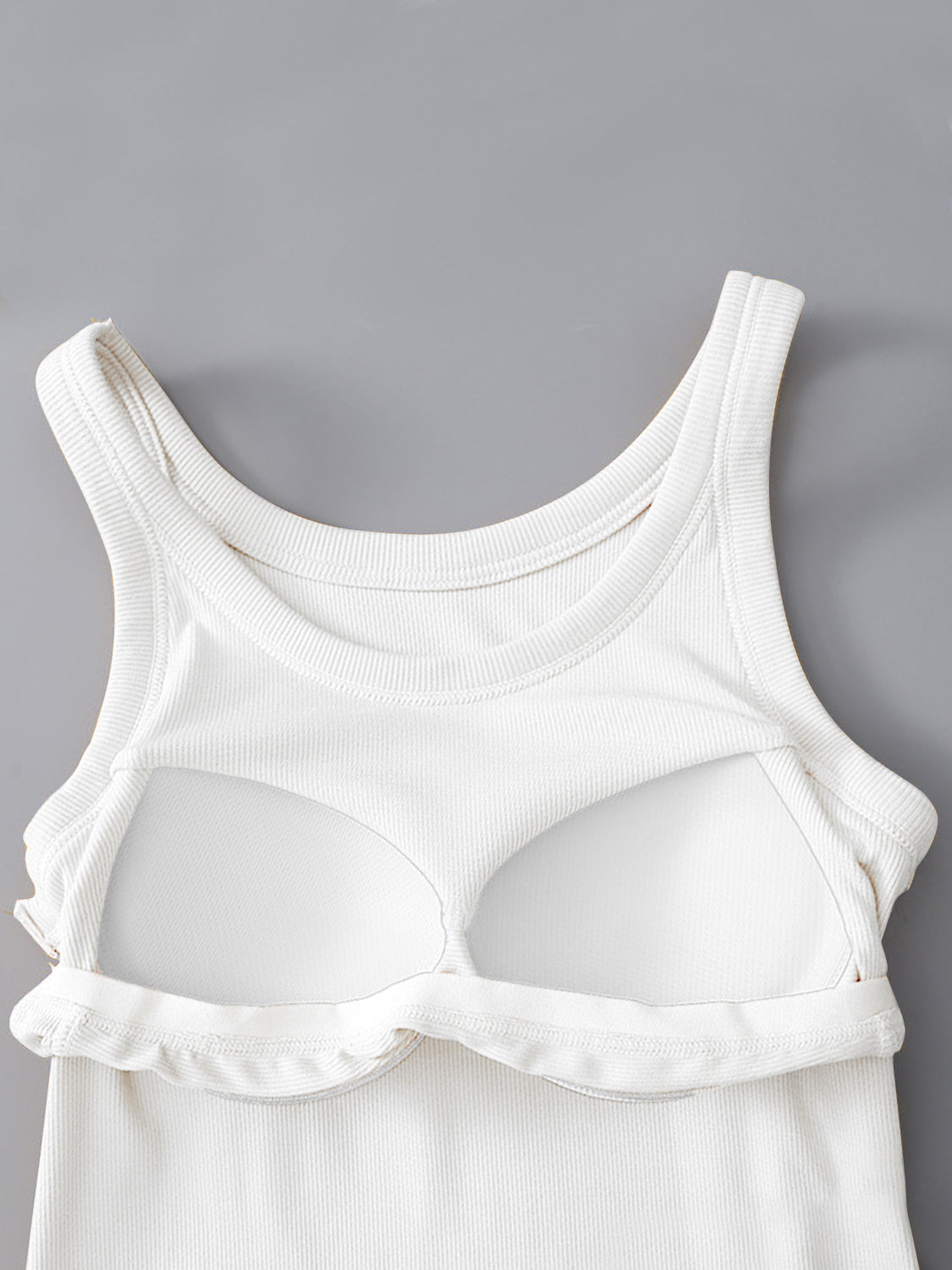 Round neck tank with built-in bra, white, viscose and spandex blend.