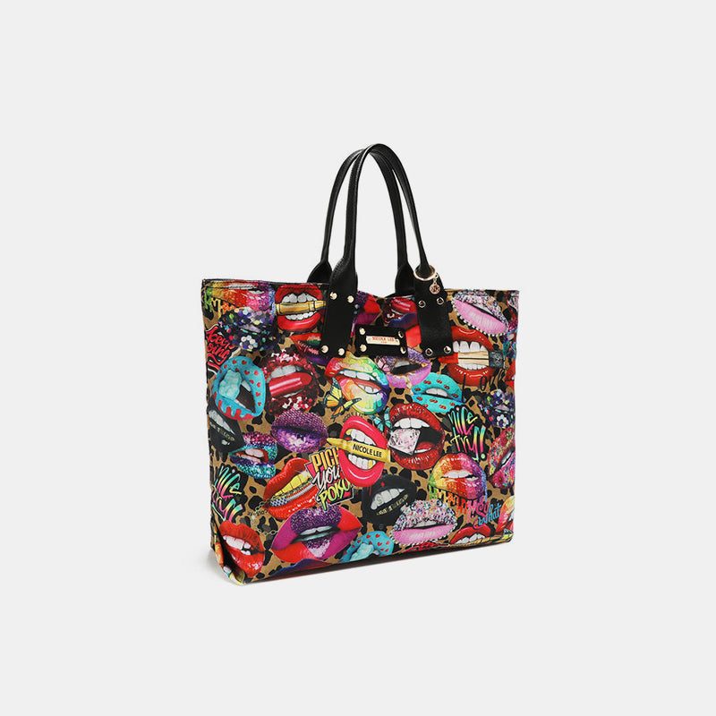 Nicole Lee USA printed reversible medium vegan leather handbag with dual top handles.