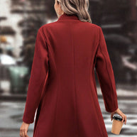 Collared neck button up long sleeve coat in red, polyester-spandex blend, shown from the back.