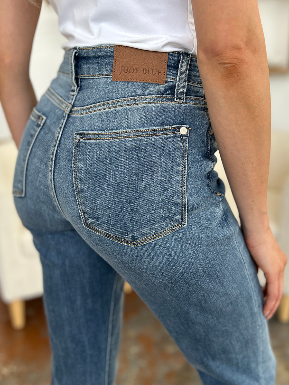 Judy Blue Full Size Cuffed Hem Slim Jeans, back view, high-waisted fit, classic denim color.