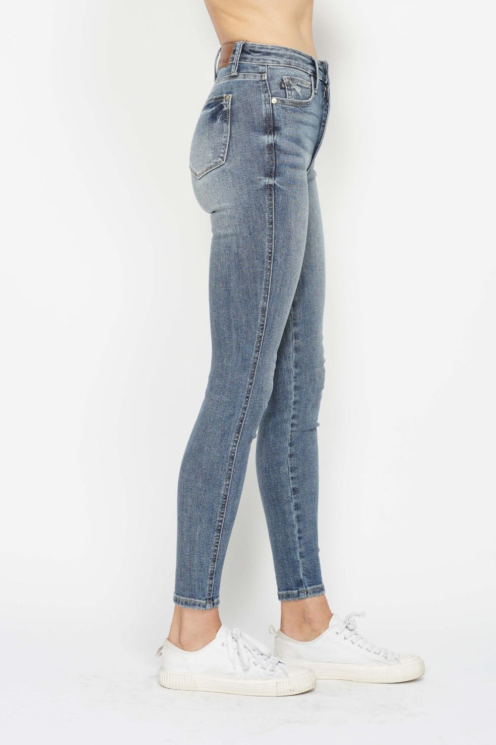 Judy Blue Full Size Tummy Control Contrast Wash Skinny Jeans with tummy control and modern wash.