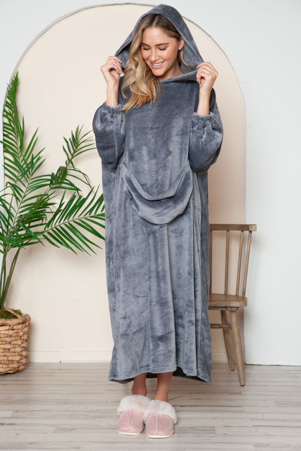 Pocketed hooded midi lounge dress with slight stretch and plush texture.