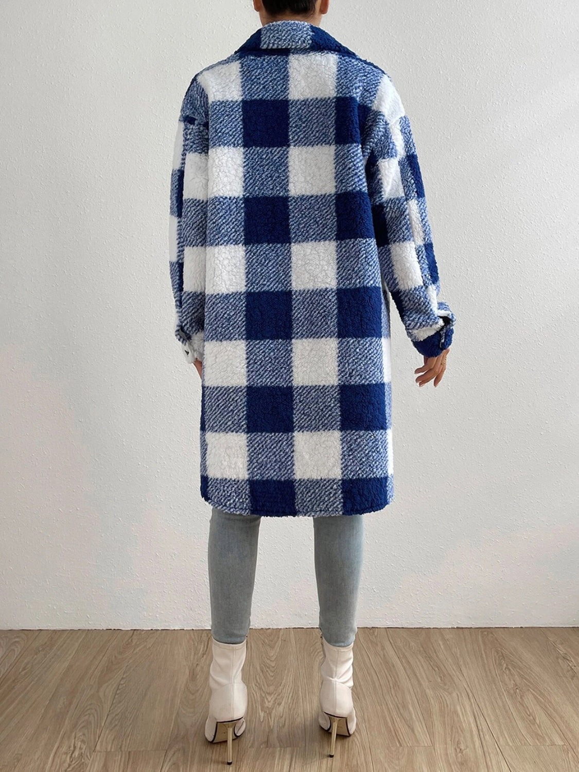 Plaid collared neck button down coat, blue and white checkered pattern.