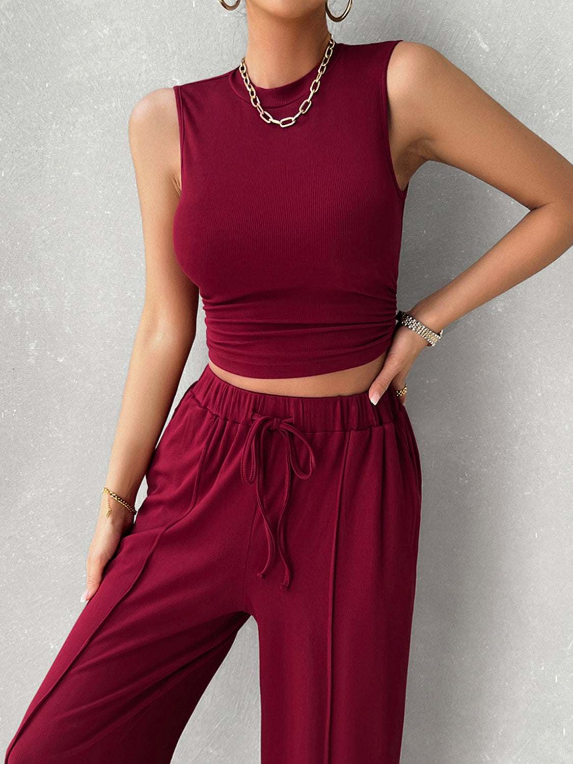 Devine Mock Neck Sleeveless Top and Drawstring Pants Set in burgundy, stretchy polyester blend.