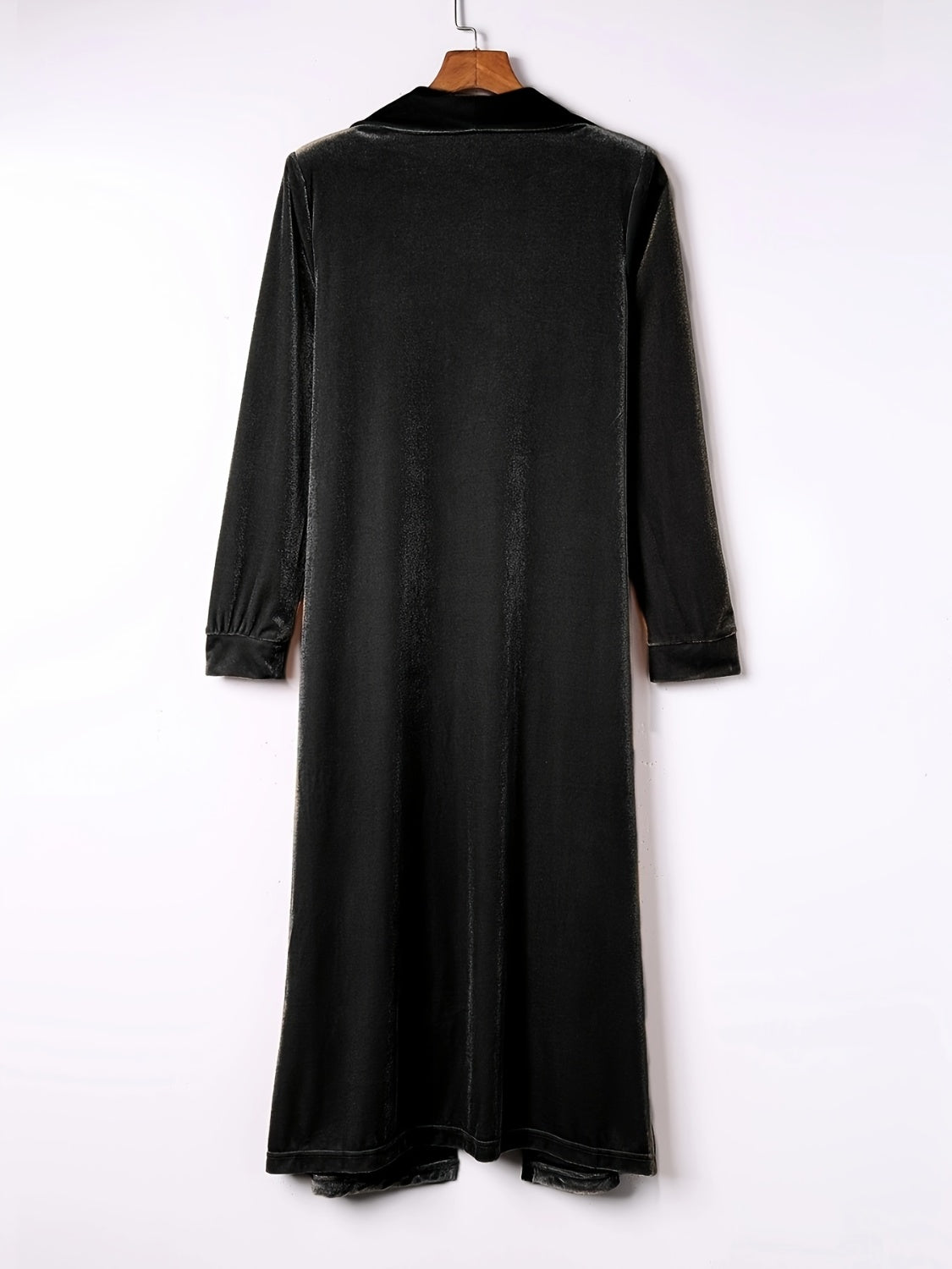 Open front long sleeve coat in black, polyester material, slit design.