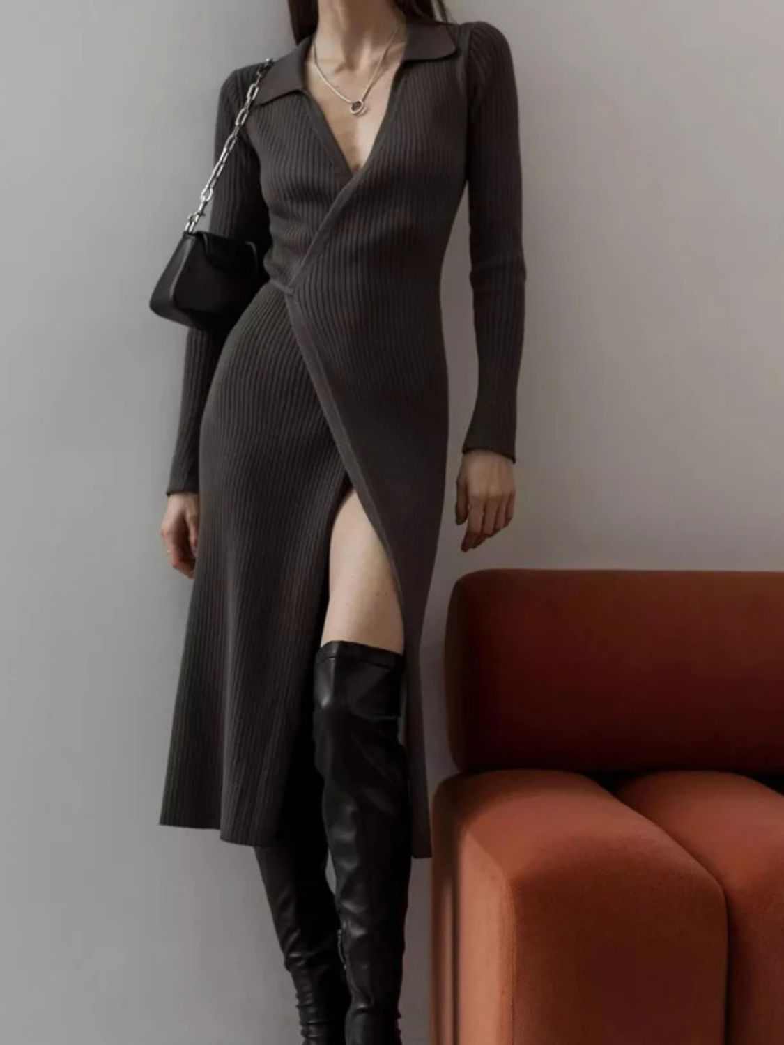 Tied collared neck long sleeve sweater dress with slit and moderate stretch.