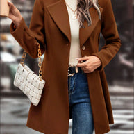 Brown collared neck button up long sleeve coat with casual outfit.