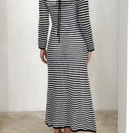 Devine Tied Round Neck Striped Sweater Dress in black and white with moderate stretch, made of 100% viscose.