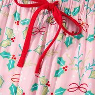 Pink lounge pants with printed festive holly design and red drawstring tie.