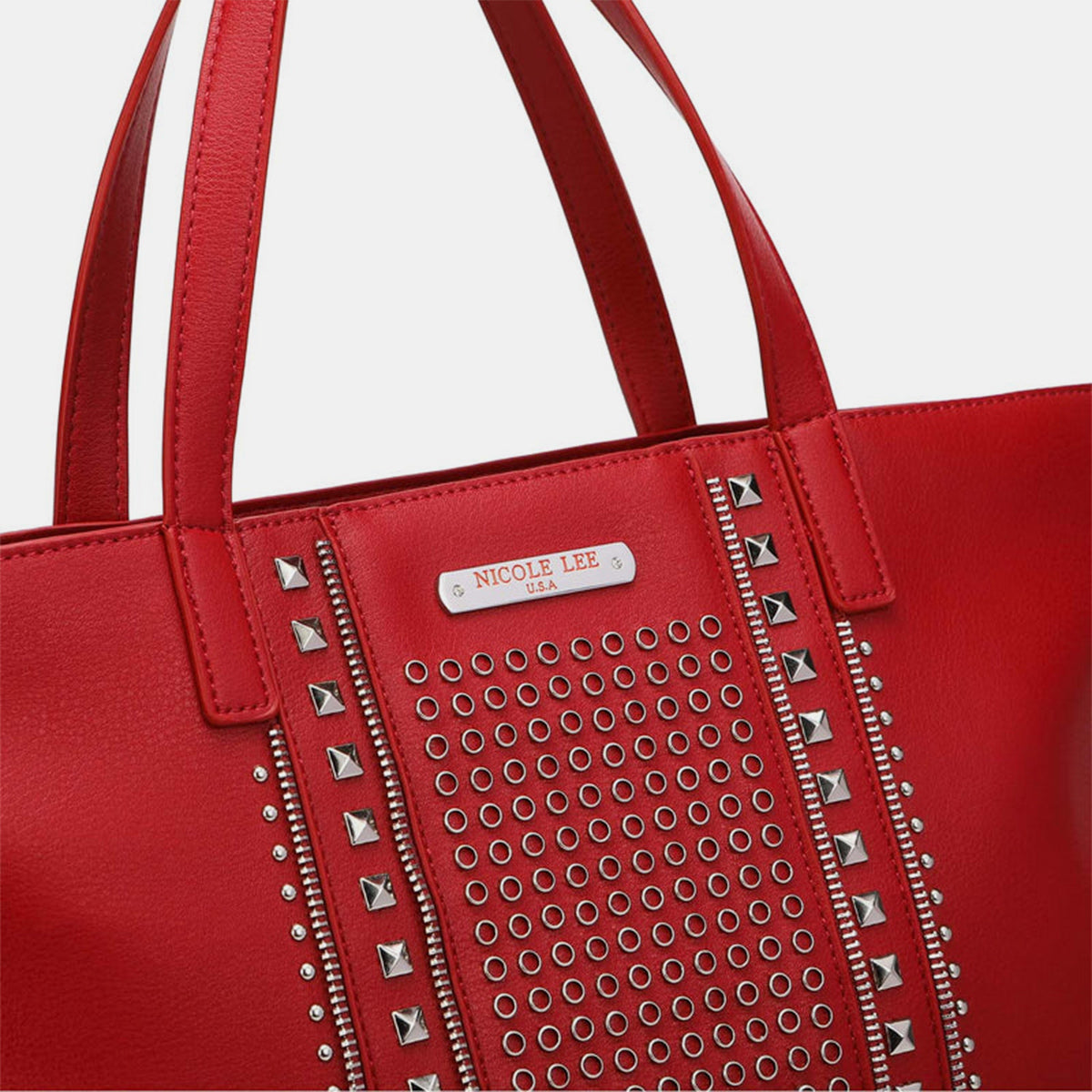 Nicole Lee USA studded large tote bag in red vegan leather with dual top handles and stud detailing.