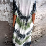 Full size pocketed tie-dye short sleeve dress with green and black design.