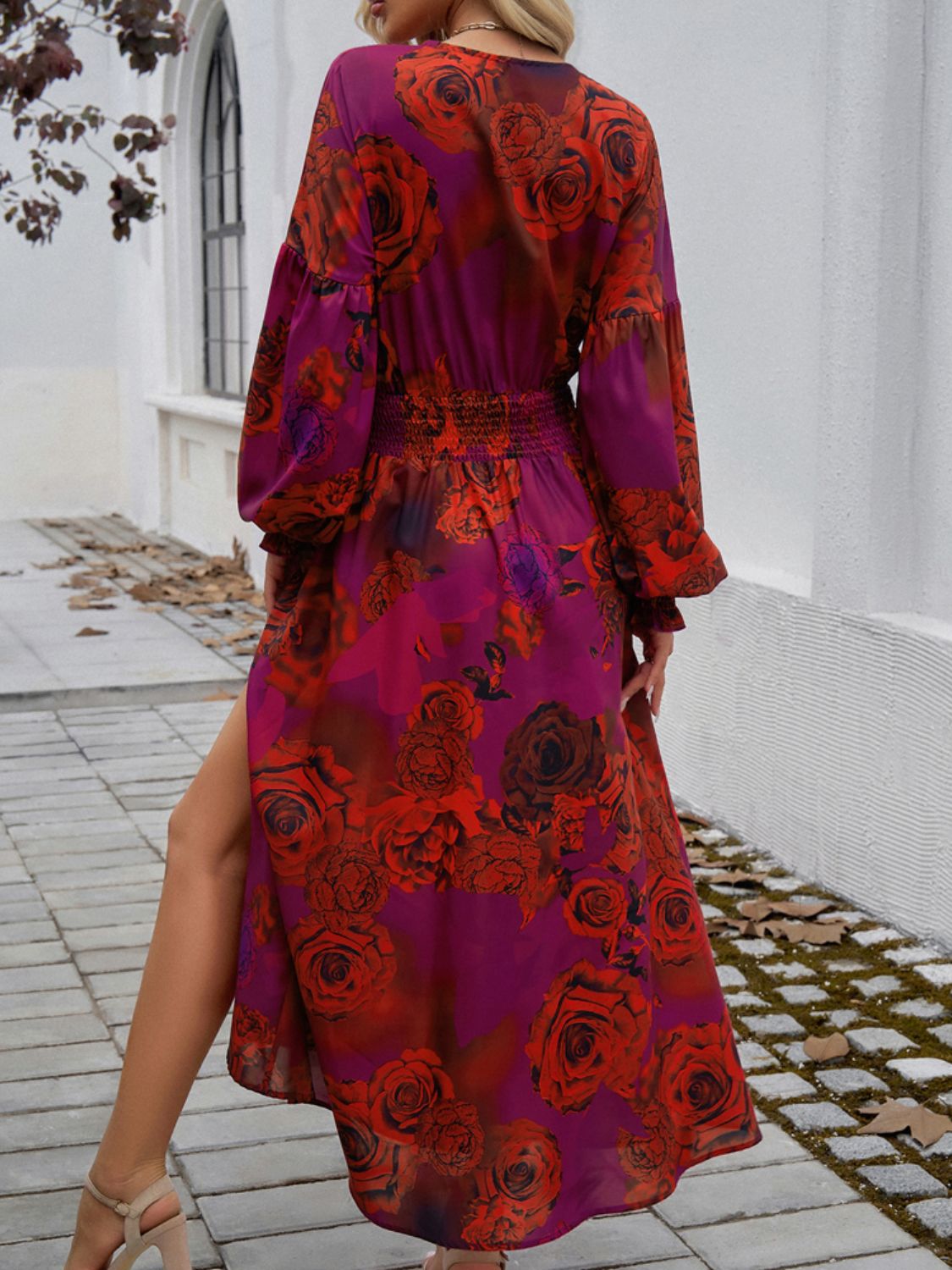 Split printed surplice long sleeve midi dress with floral design and side slit.