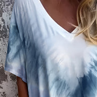 Full Size Pocketed Tie-Dye Short Sleeve Dress with V-neck detail.