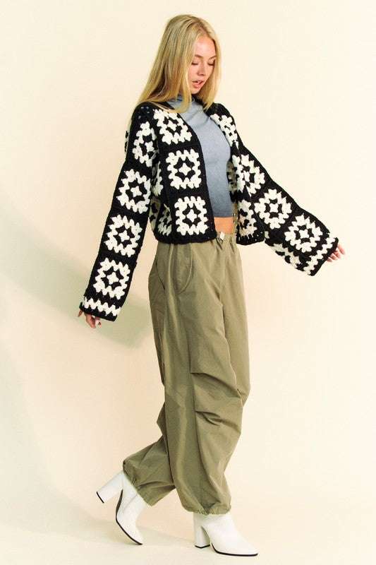 Two-tone flower square crochet open front cardigan on model.