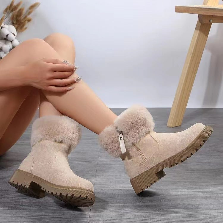 Suede faux fur boots with side zipper and low heel, made from rubber, faux fur, and suede.